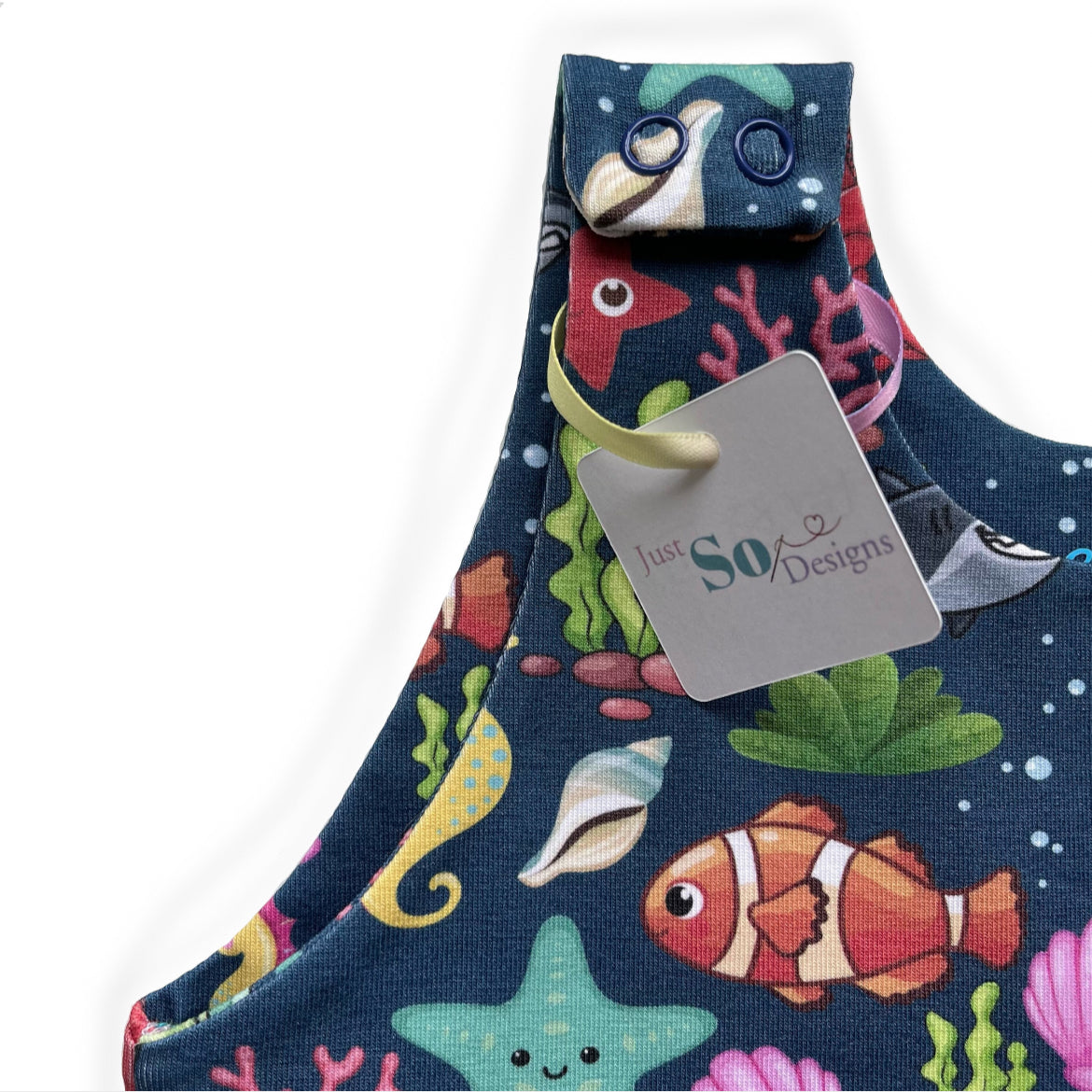 Blue sea animal romper handmade for babies and toddlers, fun for running, jumping and climbing. Dungarees style outfit in a stretchy cotton fabric handmade in Oxfordshire.