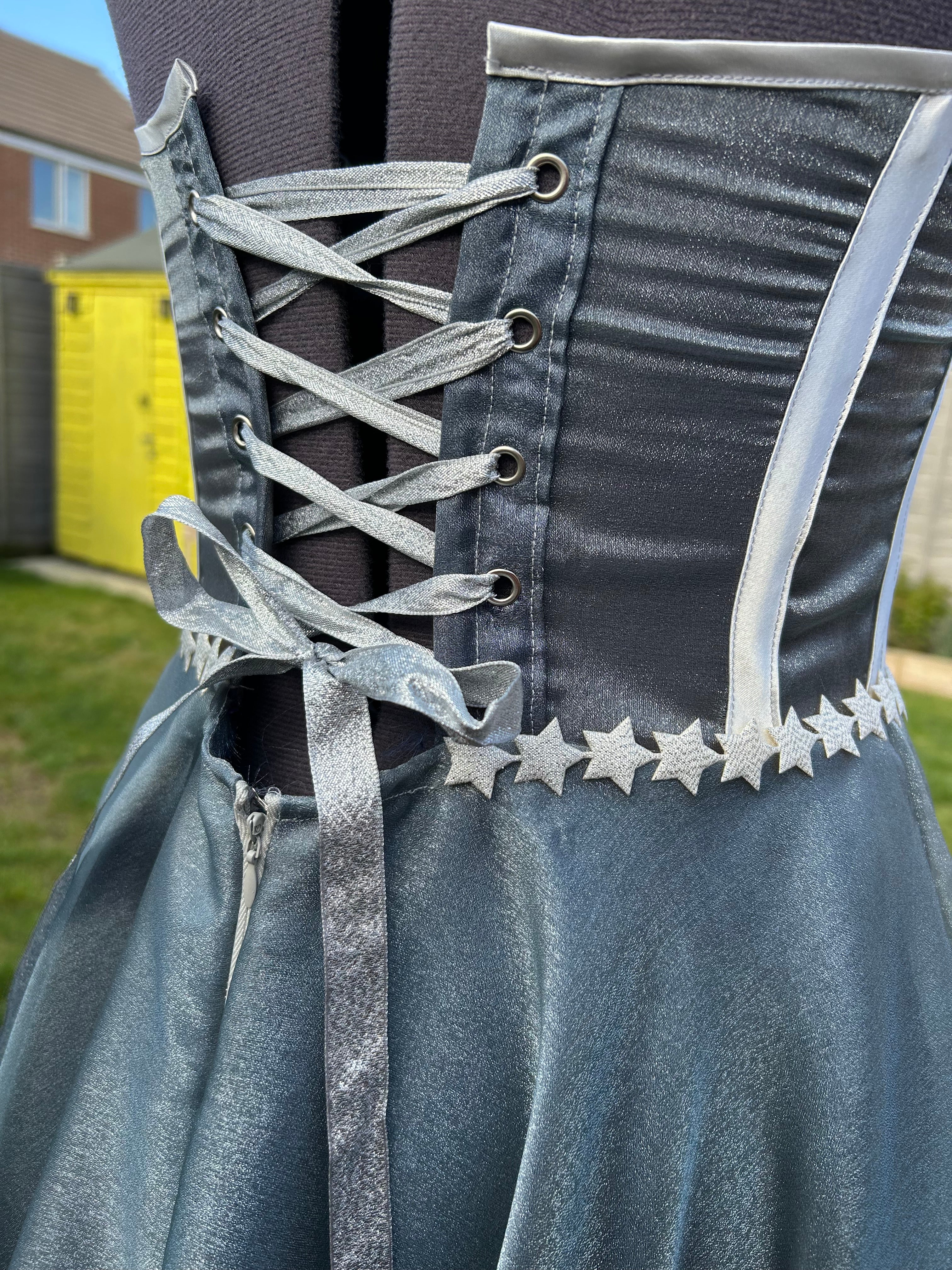 This handmade formal gown, inspired by the Starfall dress from ACOTAR, features a structured bodice, flowing skirt, and delicate star embellishments for a magical look.