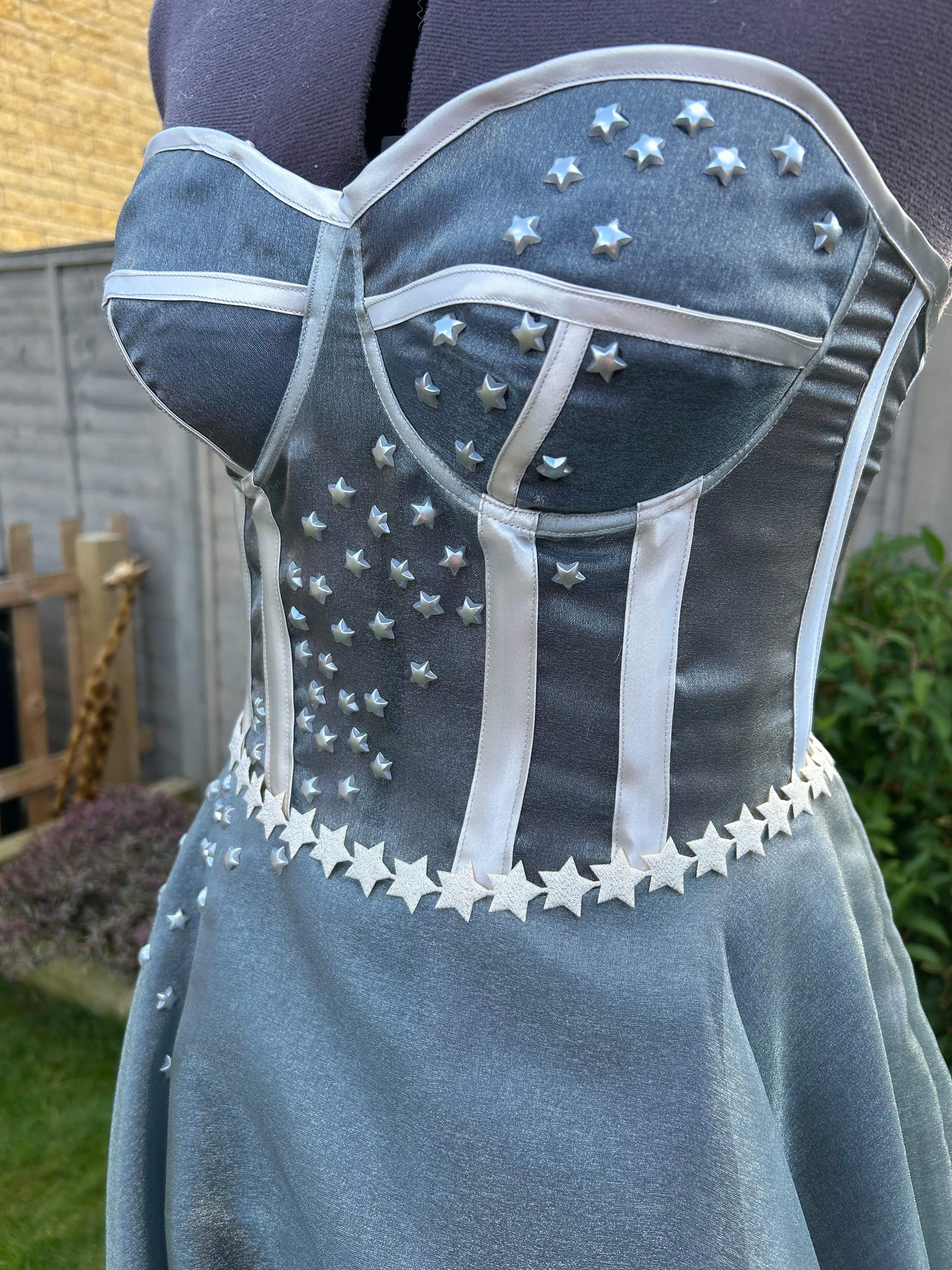 This handmade formal gown, inspired by the Starfall dress from ACOTAR, features a structured bodice, flowing skirt, and delicate star embellishments for a magical look.