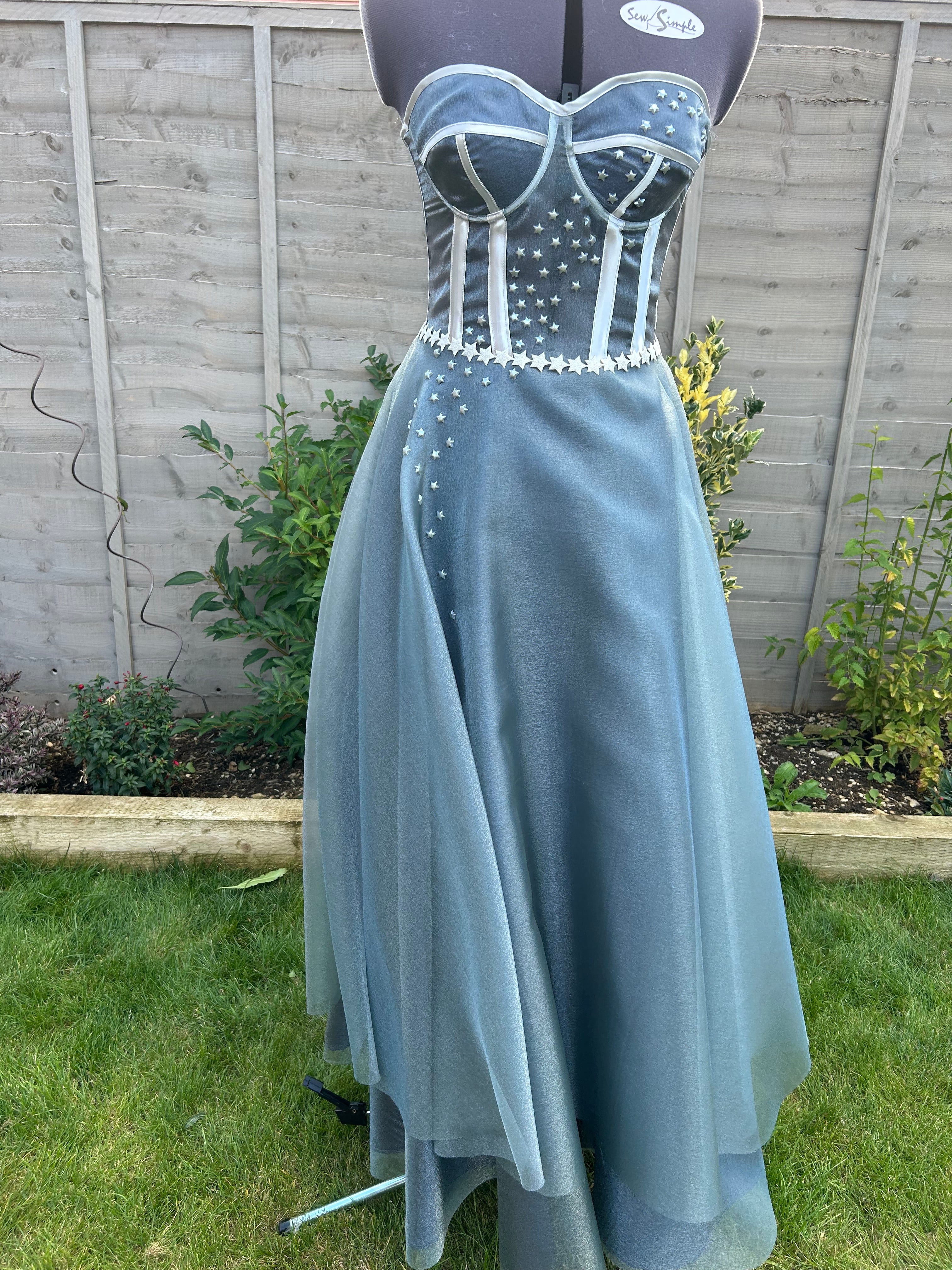 This handmade formal gown, inspired by the Starfall dress from ACOTAR, features a structured bodice, flowing skirt, and delicate star embellishments for a magical look.