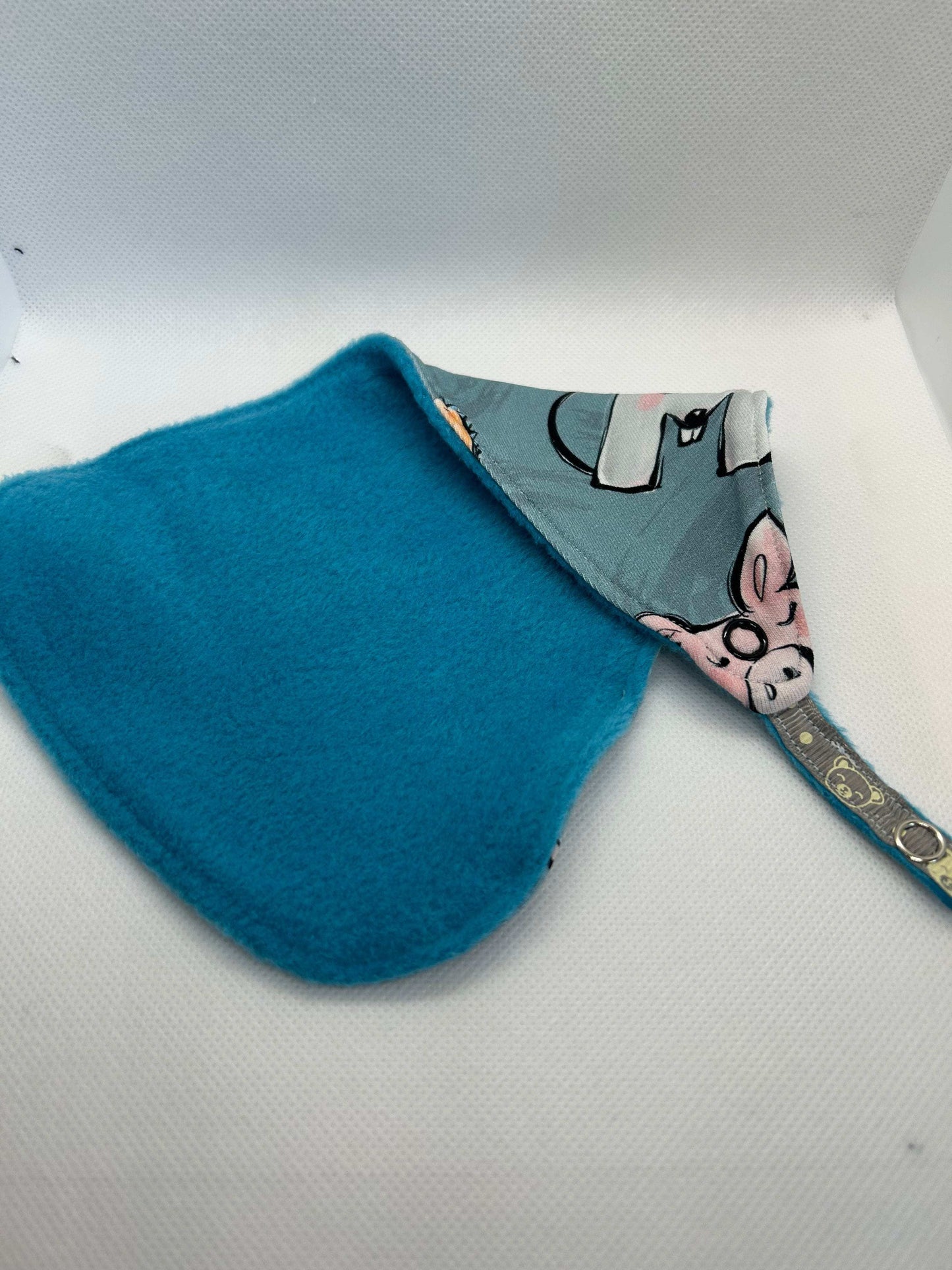 Handmade dummy comforter is the perfect soothing companion. Crafted from soft, baby safe jersey cotton and fleece. Keeps dummies and pacifiers close whilst offering cuddly comfort for little ones.