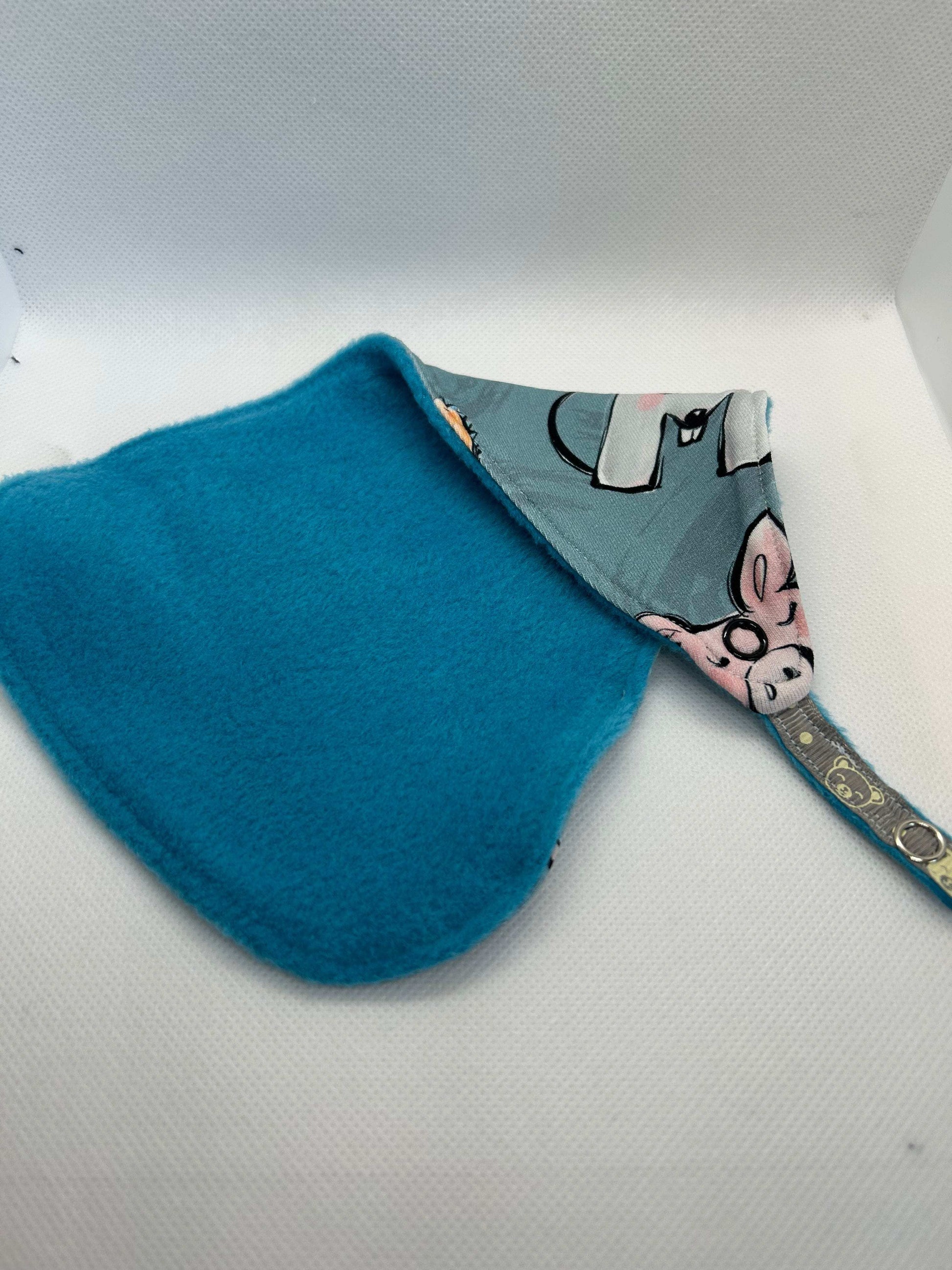 Handmade dummy comforter is the perfect soothing companion. Crafted from soft, baby safe jersey cotton and fleece. Keeps dummies and pacifiers close whilst offering cuddly comfort for little ones.