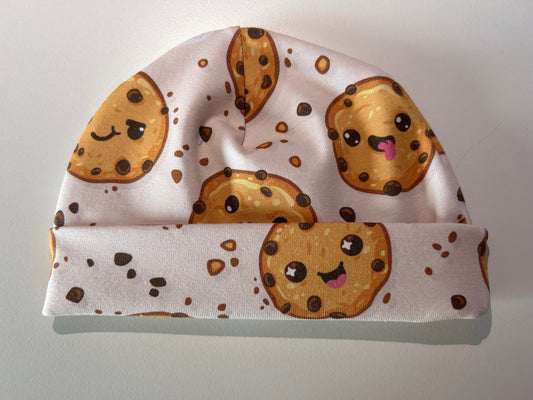 Baby hat with cookie pattern, handmade in Oxfordshire