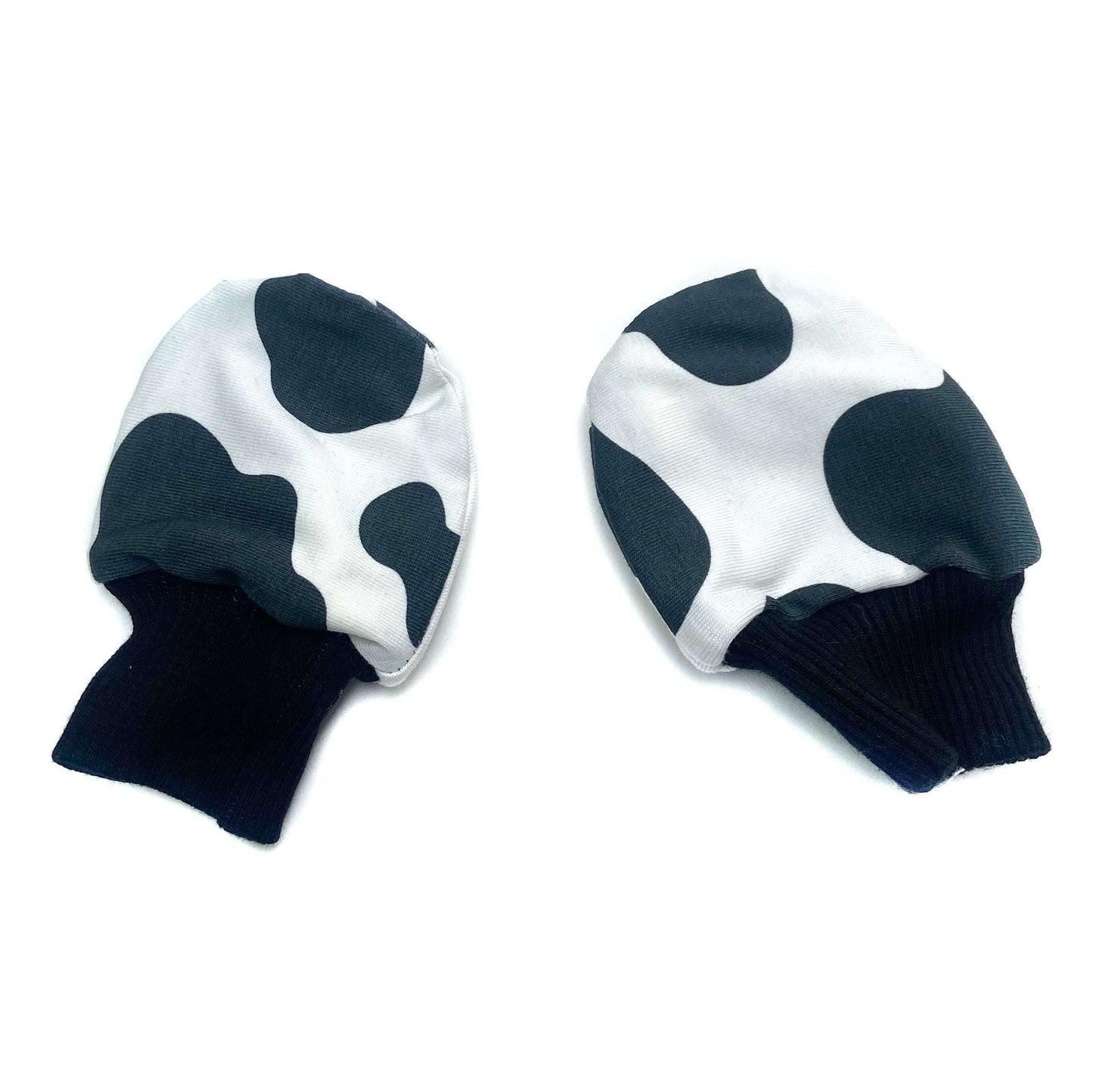 Gorgeous little baby mittens in a bold monochrome cow print, perfect for baby gifts, growing hands to give plenty of movement and to match outfits. 
