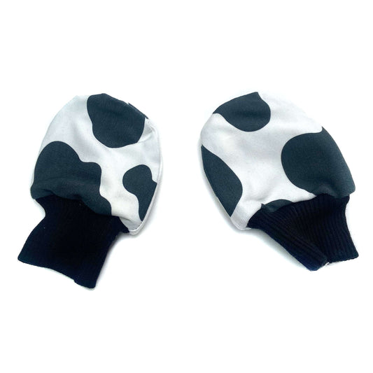Gorgeous little baby mittens in a bold monochrome cow print, perfect for baby gifts, growing hands to give plenty of movement and to match outfits. 