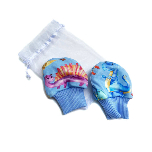 Gorgeous little baby mittens in a bold blue dinosaur print, perfect for baby gifts, growing hands to give plenty of movement and to match outfits. 
