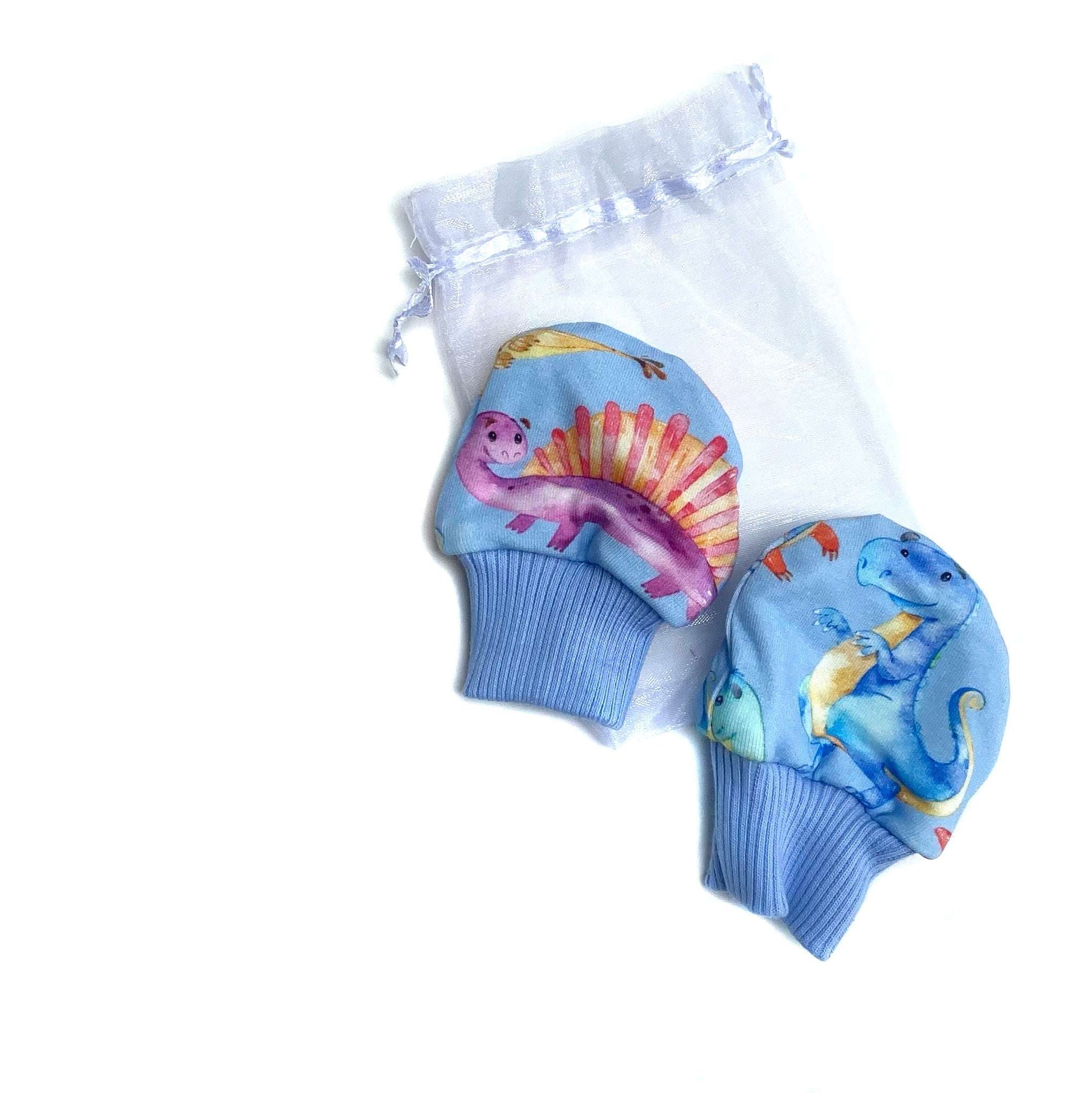 Gorgeous little baby mittens in a bold blue dinosaur print, perfect for baby gifts, growing hands to give plenty of movement and to match outfits. 