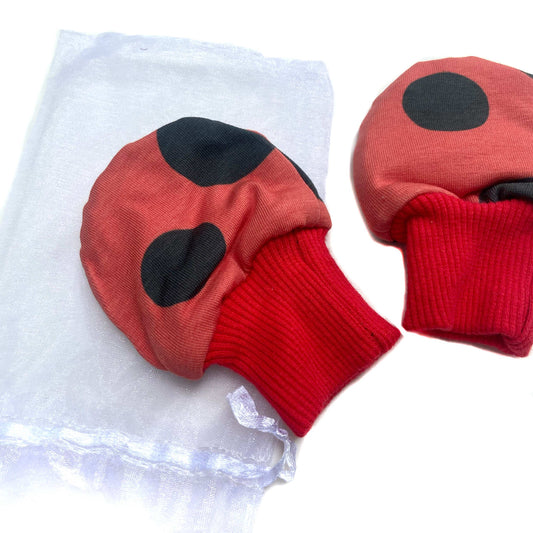 Gorgeous little baby mittens in a bold ladybird print, perfect for baby gifts, growing hands to give plenty of movement and to match outfits. 