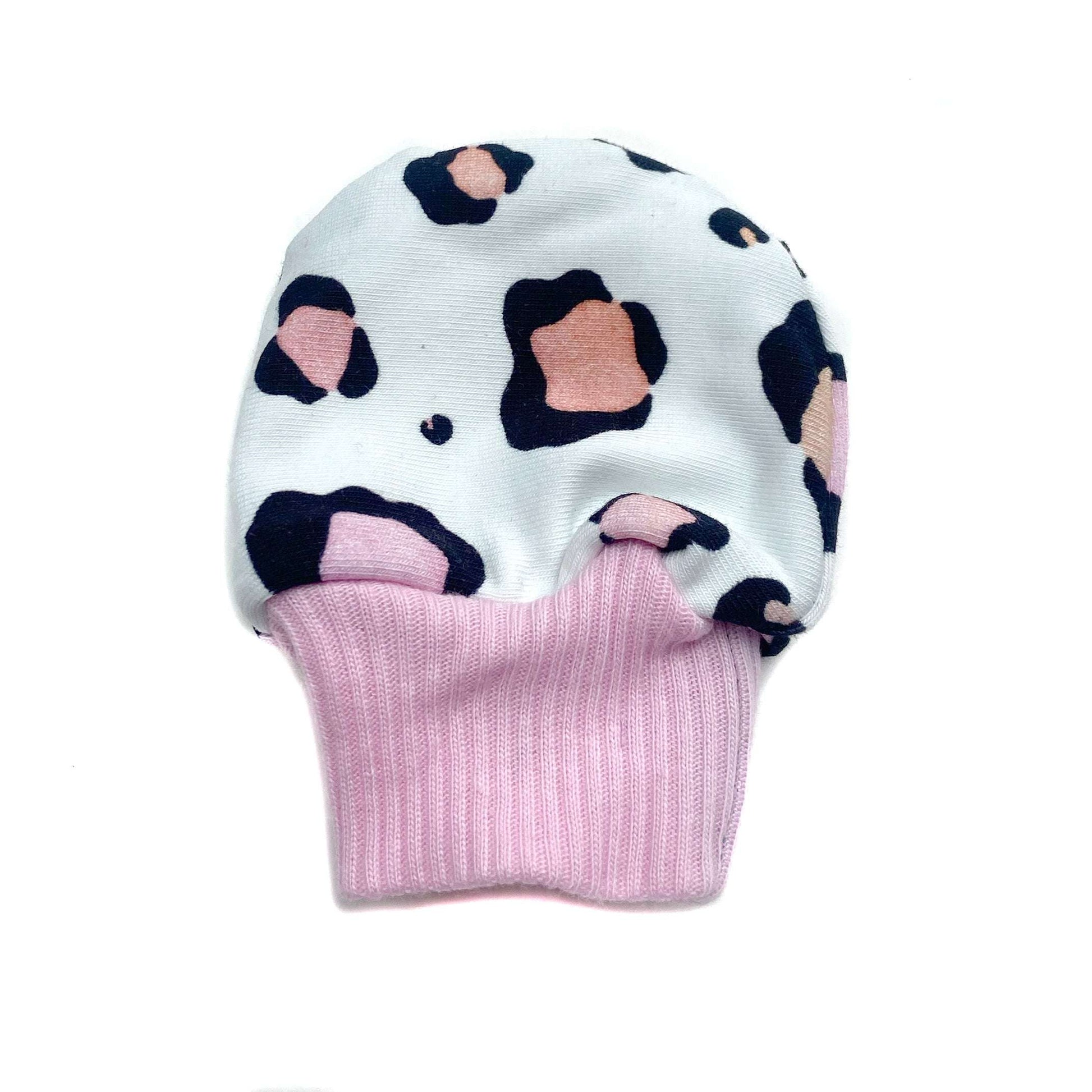 Gorgeous little baby mittens in a bold leopard print, perfect for baby gifts, growing hands to give plenty of movement and to match outfits. 