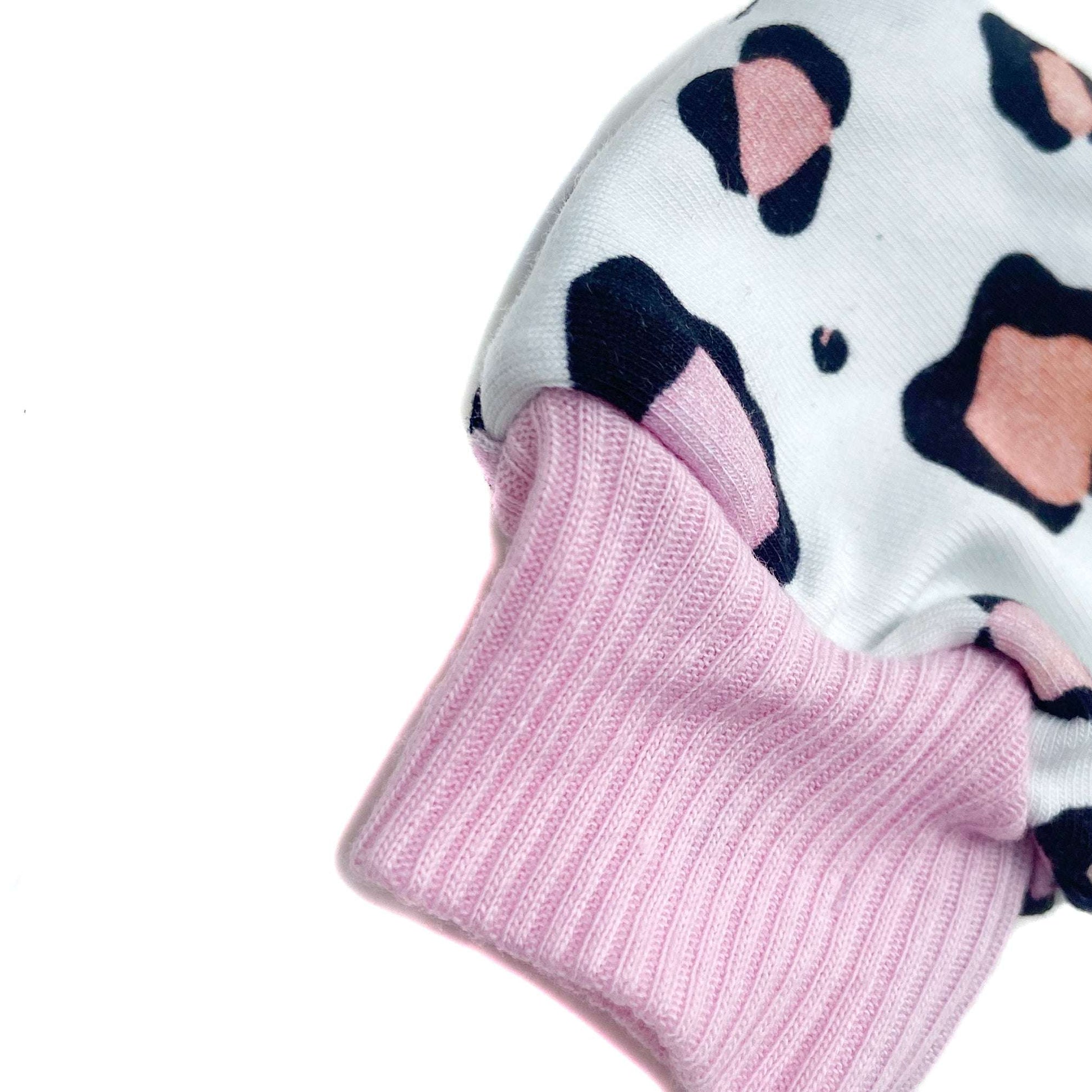 Gorgeous little baby mittens in a bold pastel leopard print, perfect for baby gifts, growing hands to give plenty of movement and to match outfits. 