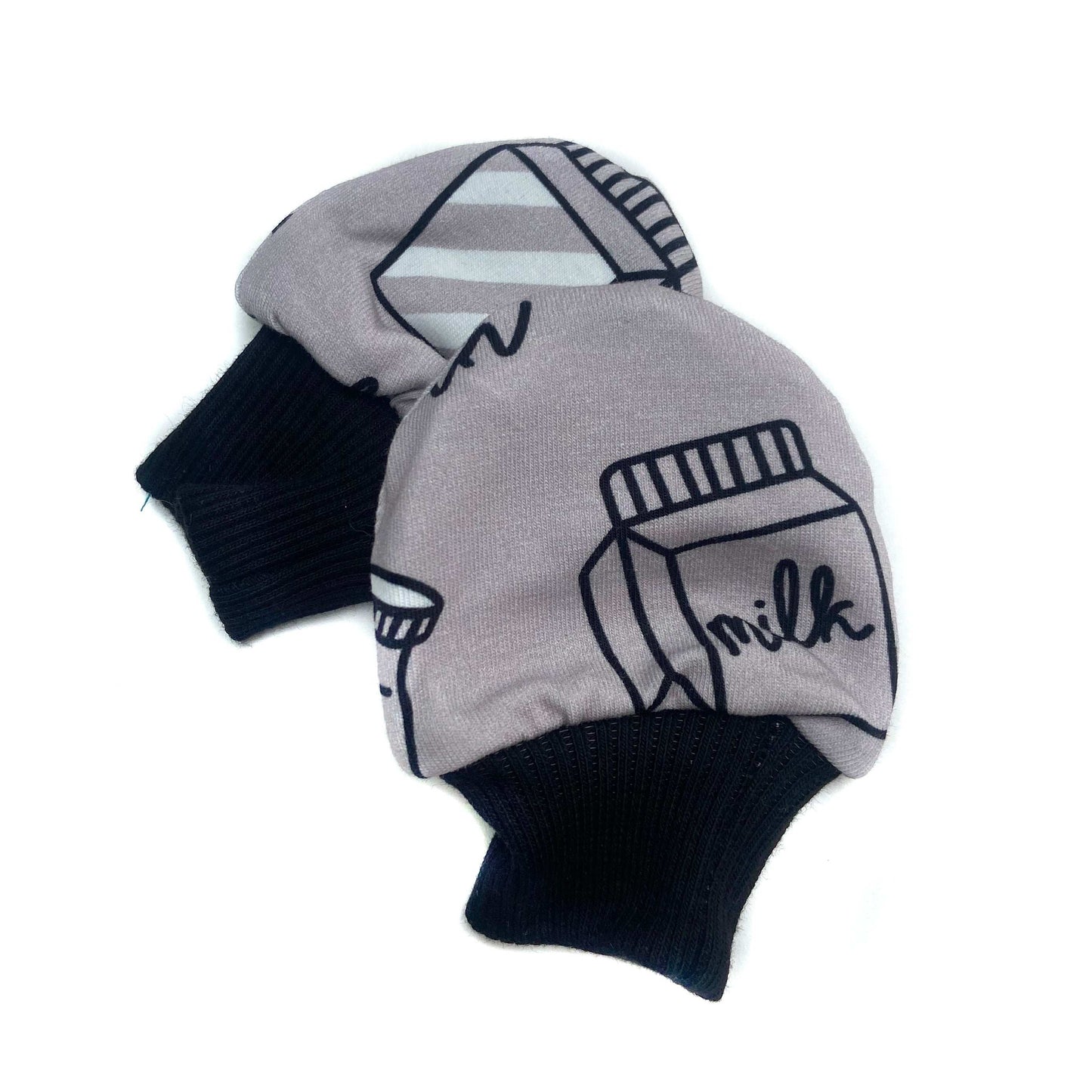 Gorgeous little baby mittens in a bold monochrome milk print, perfect for baby gifts, growing hands to give plenty of movement and to match outfits. 