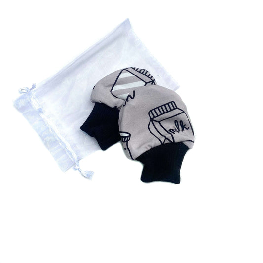 Gorgeous little baby mittens in a bold monochrome milk print, perfect for baby gifts, growing hands to give plenty of movement and to match outfits. 