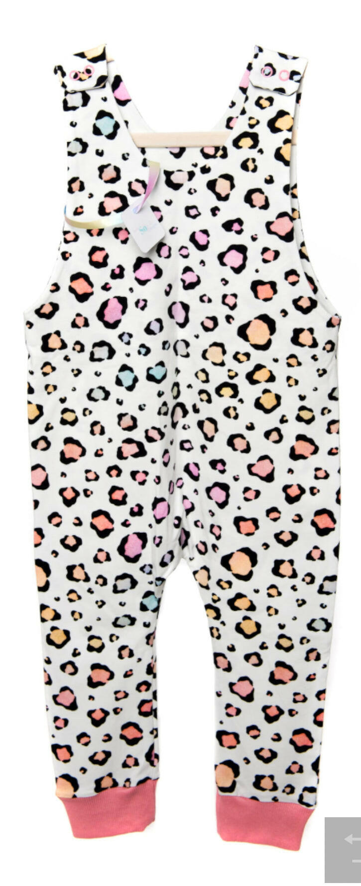 Pink pastel leopard print romper handmade for babies and toddlers, fun for running, jumping and climbing. Dungarees style outfit in a stretchy cotton fabric handmade in Oxfordshire.