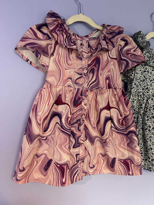 Handmade girls marble print dress with ruffle neckline and button front. Unique, comfy children's clothing made in the UK