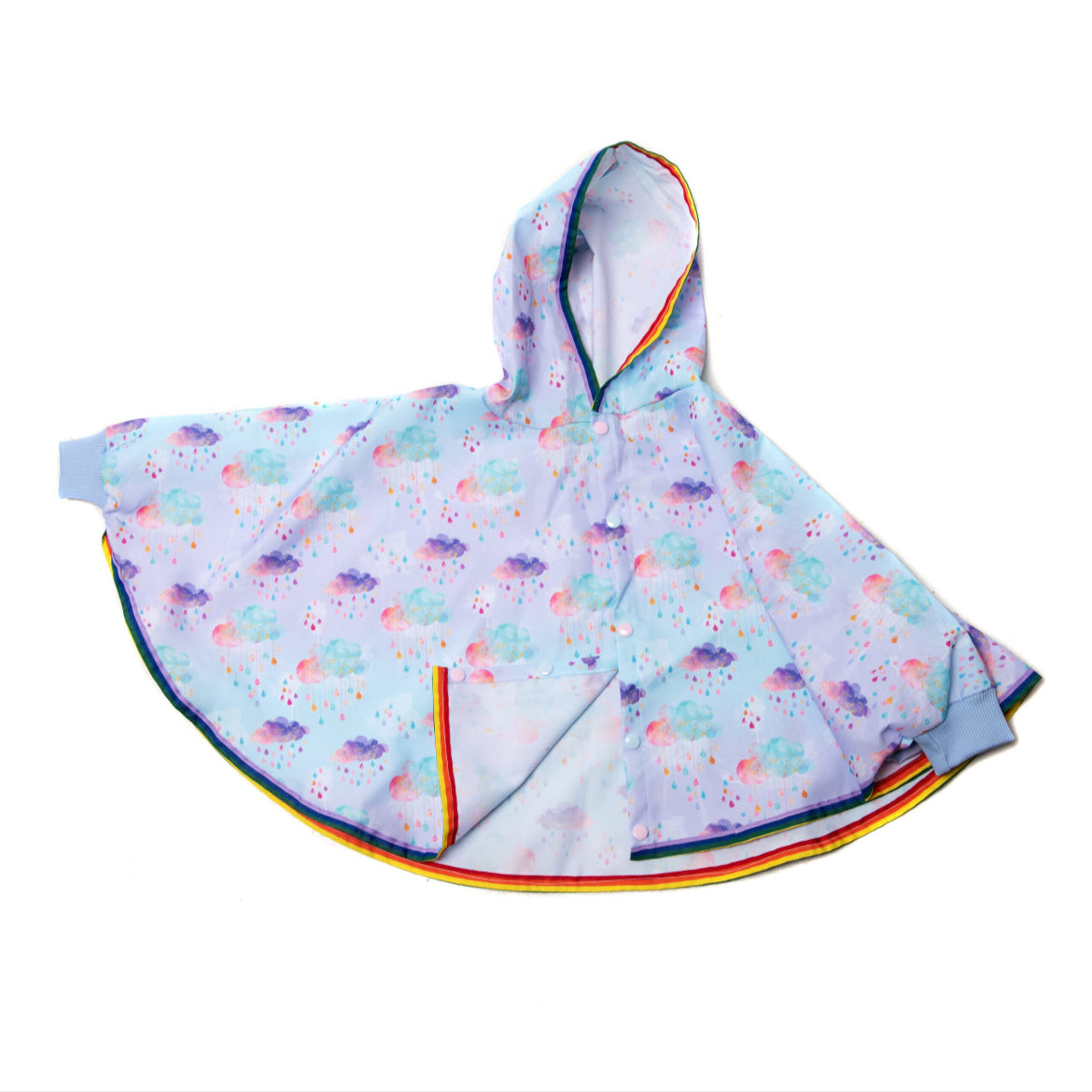 Keep little adventurers dry in style with this handmade waterproof cape, featuring a playful umbrella print, rainbow trim and roomy fit for carefree outdoor fun in any weather.
