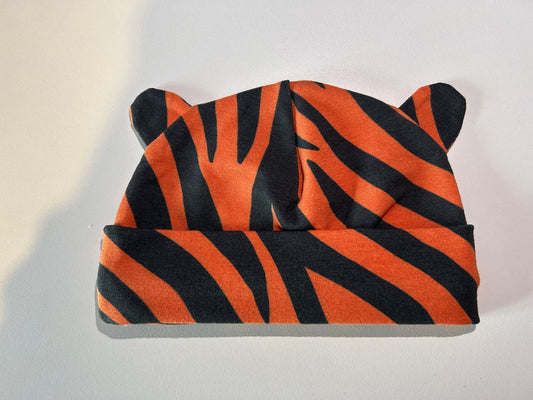 Baby hat with bold tiger pattern, handmade in Oxfordshire