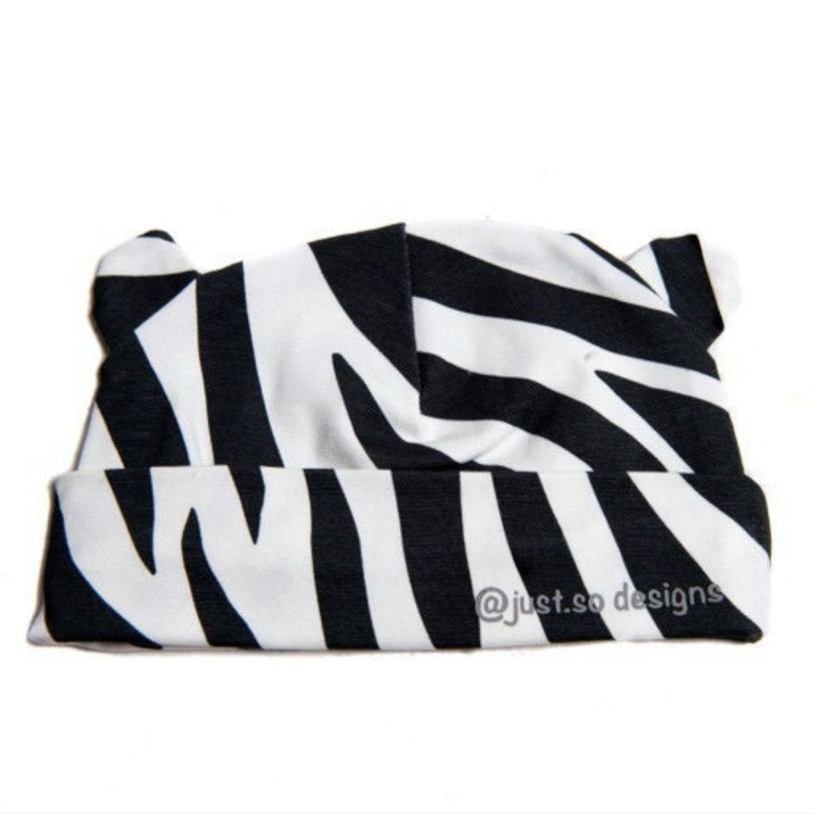 Keep your little one cozy and cute in our handmade zebra-print beanie with playful ears. Made with soft, stretchy fabric for comfort and style. Perfect for everyday wear!