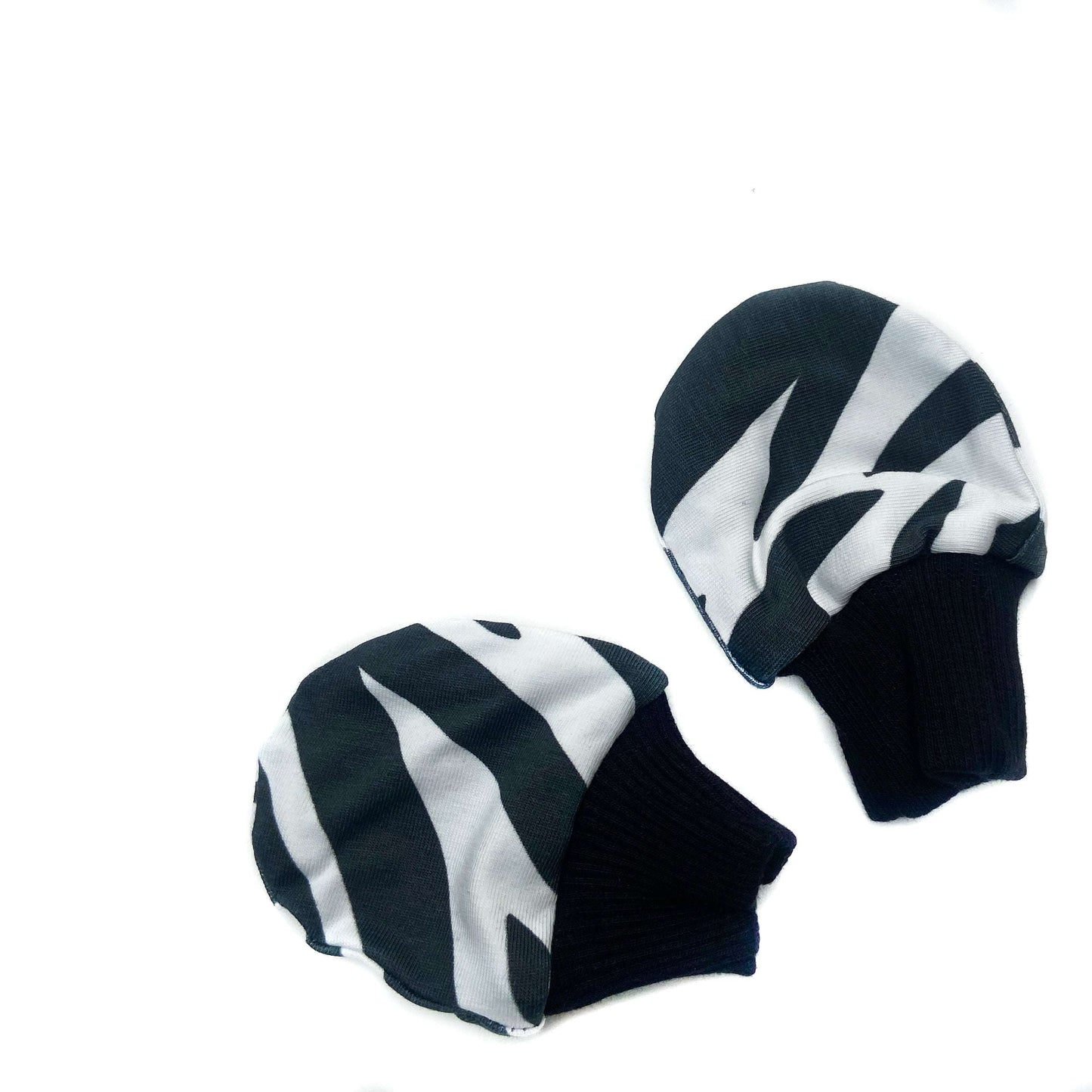 Gorgeous little baby mittens in a bold monochrome zebra print, perfect for baby gifts, growing hands to give plenty of movement and to match outfits. 