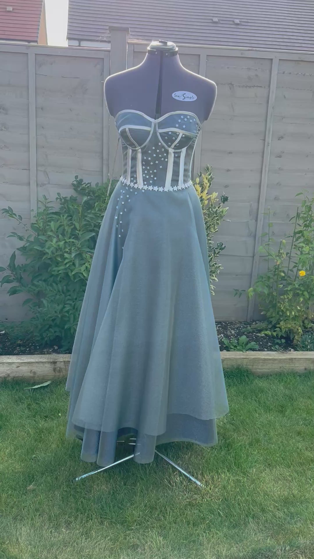 This handmade formal gown, inspired by the Starfall dress from ACOTAR, features a structured bodice, flowing skirt, and delicate star embellishments for a magical look.